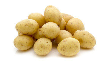 Potatoes on the white background.  New harvest.