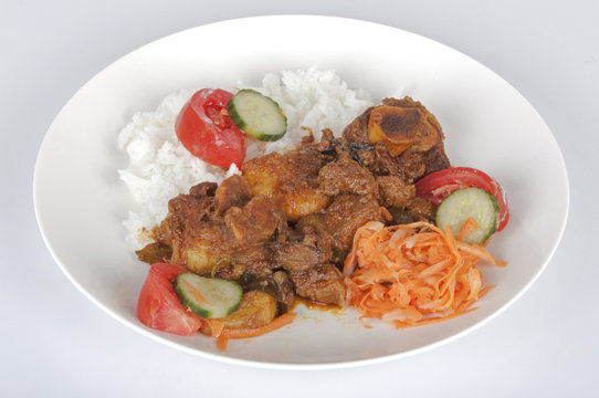 Traditional Indian Mutton Curry with Rice and Salads