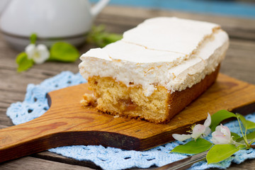 Delicious homemade cake with meringue and tea