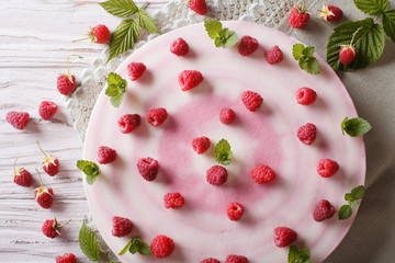 Delicious sweet cheesecake with raspberries horizontal top view
