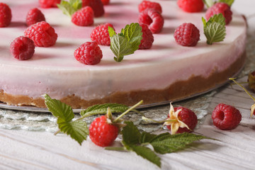 Homemade raspberry cheese cake with mint macro