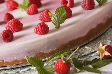 Raspberry cheesecake with mint macro on the table. Horizontal
