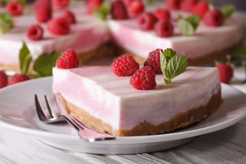 sweet cheesecake with raspberries and mint close-up on. horizontal
