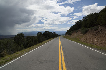 Road to the Black Canyon National Park with storm clouds.