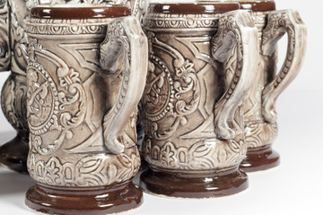 Several pitchers of beer with embossed decoration