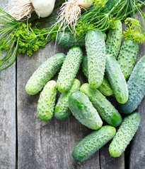 fresh cucumbers on wooden table