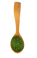 dried dill in a wooden spoon isolated