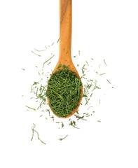 dried dill in a wooden spoon isolated