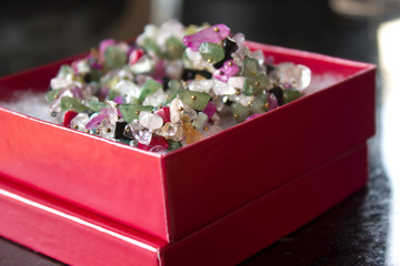 This is a photograph of mixed Gemstone necklace in a box 