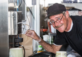 Worker with Order in Food Truck