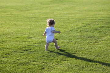 Fototapeta premium Happy boy green grass