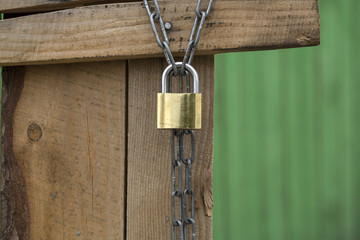 Padlock on a wooden wall