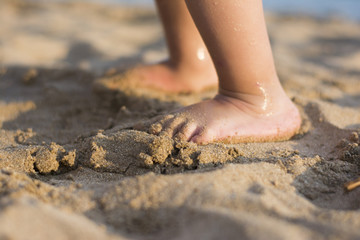 Barefoot child in the sand