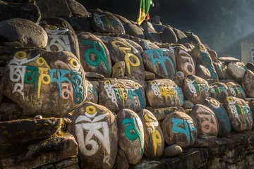 Gartenposter Stones with colorful nepalese characters © matiplanas