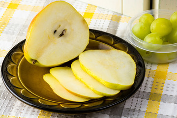 Sliced pear and grapes.