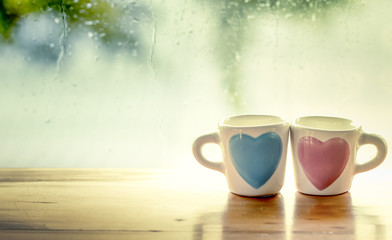two lovely glass on rainy day window background 