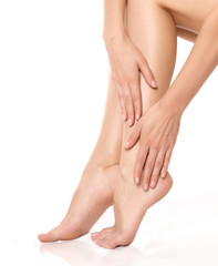 Long woman legs isolated on white. Depilation or another healths concept