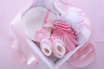 Its a Girl pink theme baby shower gift box with baby clothes, bib, bonnet, booties, pacifier and socks.