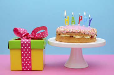 Bright color gift box with cake and candles.