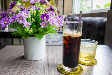 Ice black coffee and tea cup  on the table
