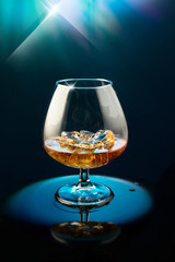 Wineglass with the whiskey and ice