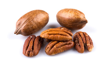 Few pecan nuts isolated on white