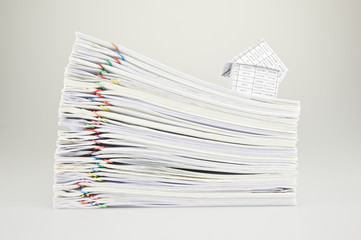 House on stack old paperwork