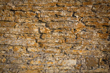 Old stone wall texture with moss