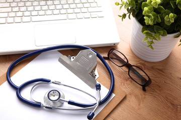 Stethoscope on laptop keyboard. Concept 3D image