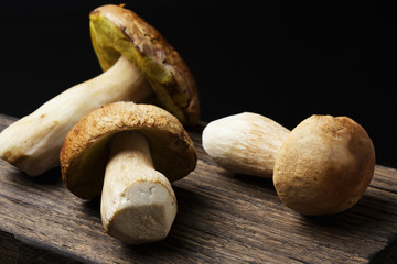 Ceps on wooden board