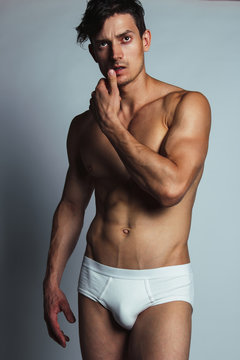 Male swimwear & underwear concept. Handsome muscular male model