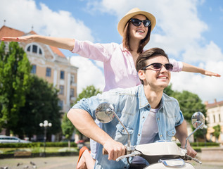 Fototapeta premium Young couple on scooter