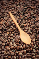 Fototapeta premium Coffee beans and wooden spoon with filter effect retro vintage s