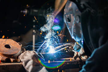 Welder in action. Low depth of focus