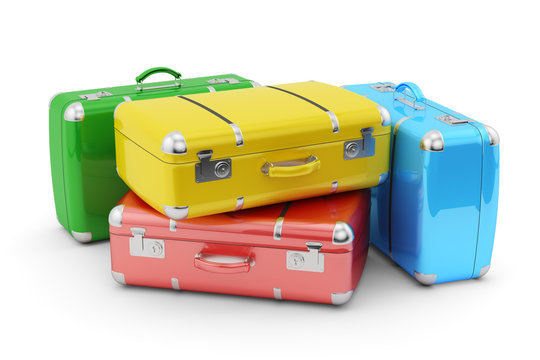Travel and vacation concept, stack of colorful suitcases isolated on white background