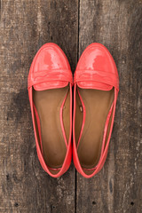 Woman clothes on old wooden background