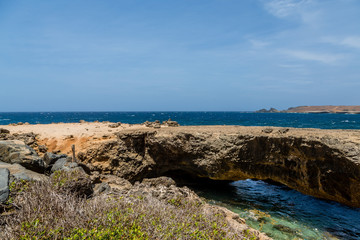 Natural Bridge Over Deep Blue Sea