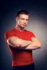 Obraz na płótnie Canvas Healthy muscular young man posing in studio