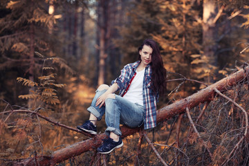 Young girl in the forest ranger