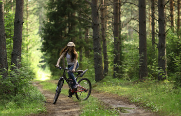 Naklejka premium teen girl bike Forest Indian Summer