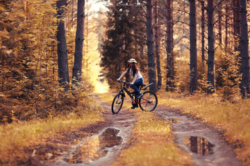 Naklejka premium teen girl bike Forest Indian Summer