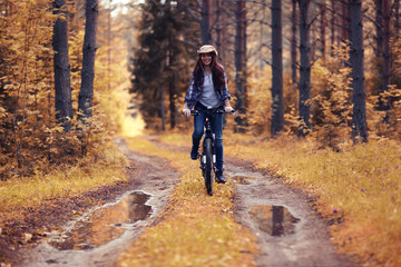 Obraz premium teen girl bike Forest Indian Summer