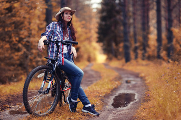 Fototapeta na wymiar teen girl bike Forest Indian Summer