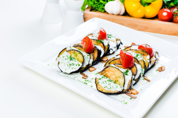 Grilled eggplant with tomatoes and sauce