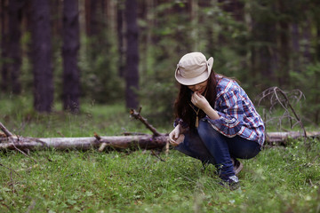 Young girl in the forest ranger