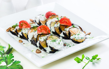 Grilled eggplant with tomatoes and sauce