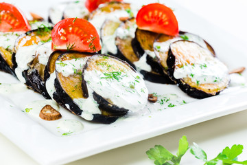 Grilled eggplant with tomatoes and sauce