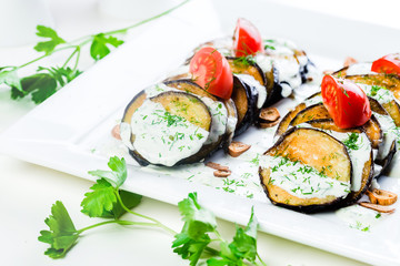 Grilled eggplant with tomatoes and sauce