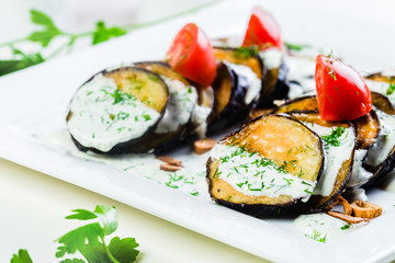 Grilled eggplant with tomatoes and sauce
