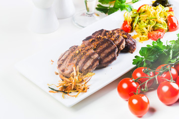 Grilled steaks with fresh vegetables